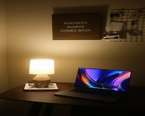 correctly lit home office with laptop and lamp